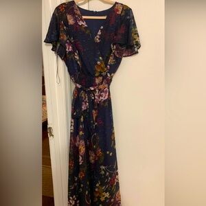 Full length navy dress with flowers.